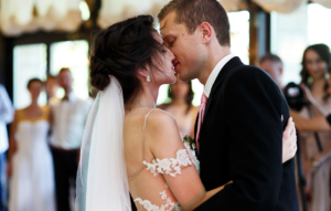 Romantic and sensual couple beautiful bride and groom dancing and kissing closeup